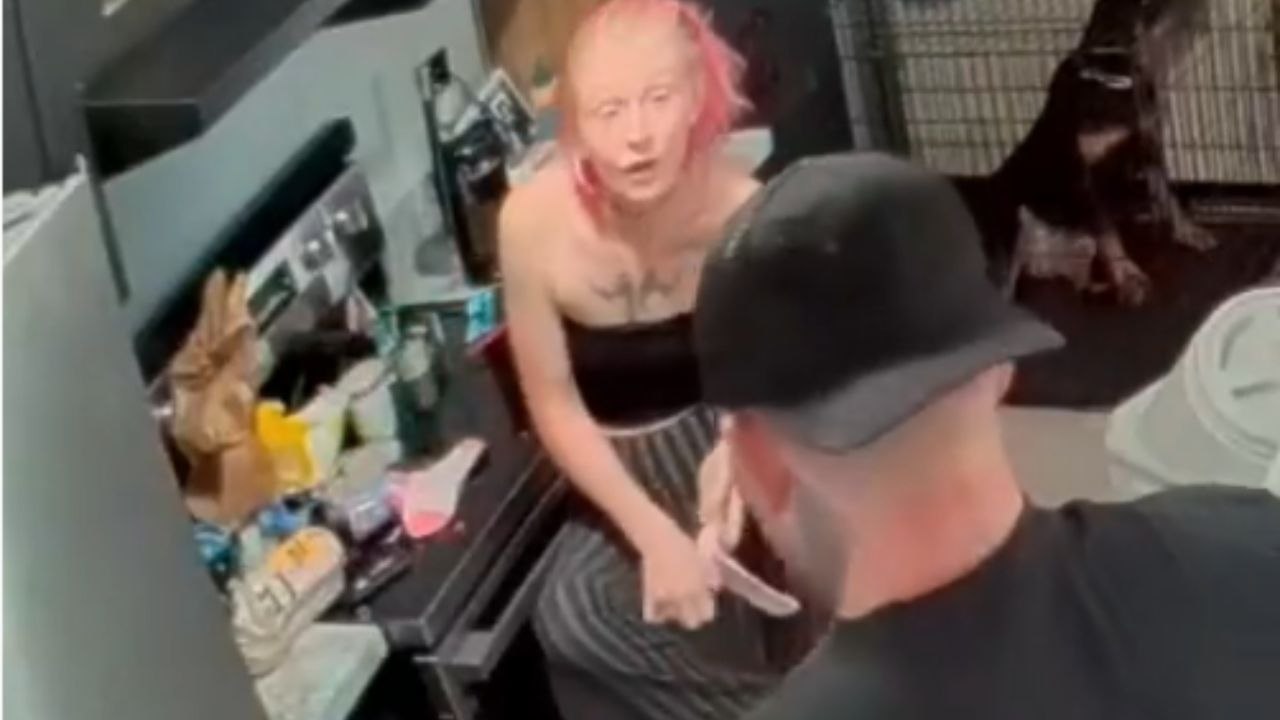 Adorable dog’s playful antics make owner tumble while she's trying to put on socks