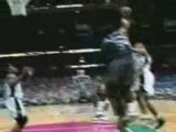 Hakeem Olajuwon blocks Tim Duncan