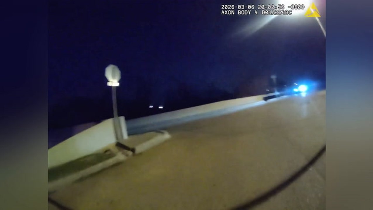 Cop rides on the hood of Good Samaritan’s car as he pursues minibike riders in Oklahoma
