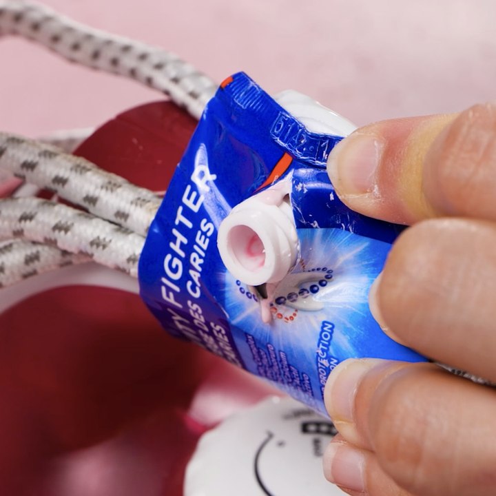 DIY cable holder using a toothpaste tube😳