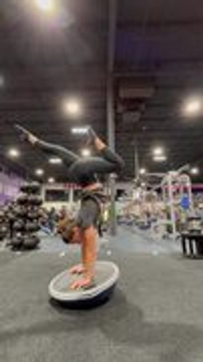 Woman Shows Incredible Control While Handstanding on Balance Ball