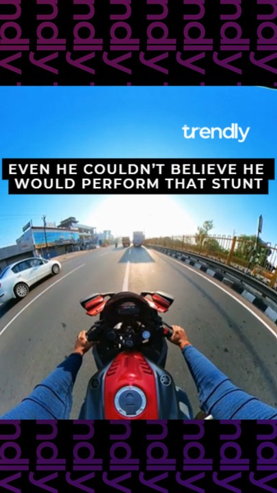 'CLOSE CALL!' - Risk-taking biker speeds through extremely narrow gap between 2 trucks