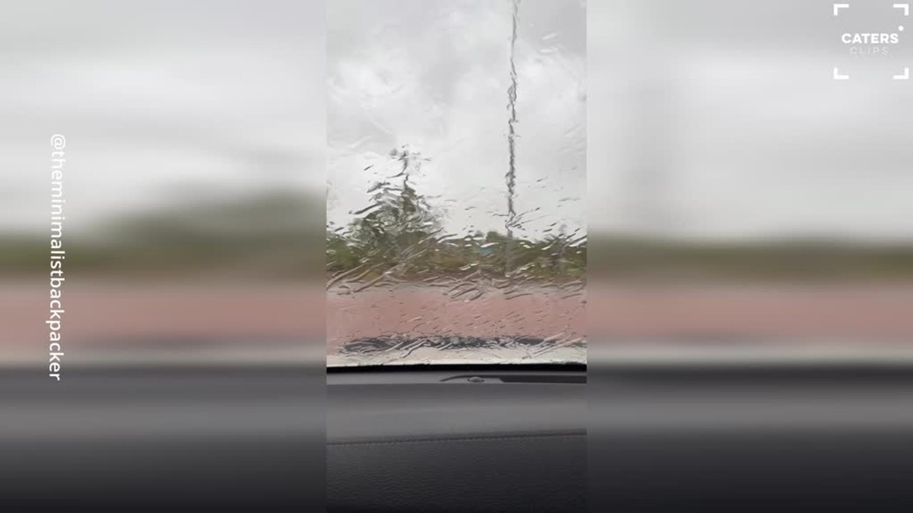 Driver Navigates Flooded Roads During Cyclone in Wickham