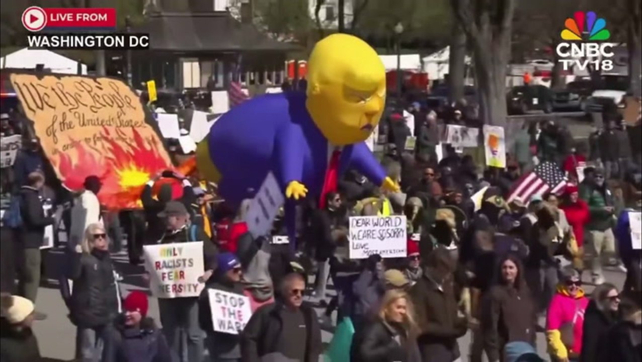 ‘No Kings’ protesters parade effigy of Trump defecating on US Constitution