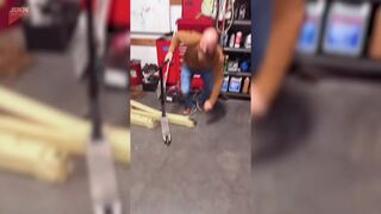 Two Men Race Scooters And One Falls