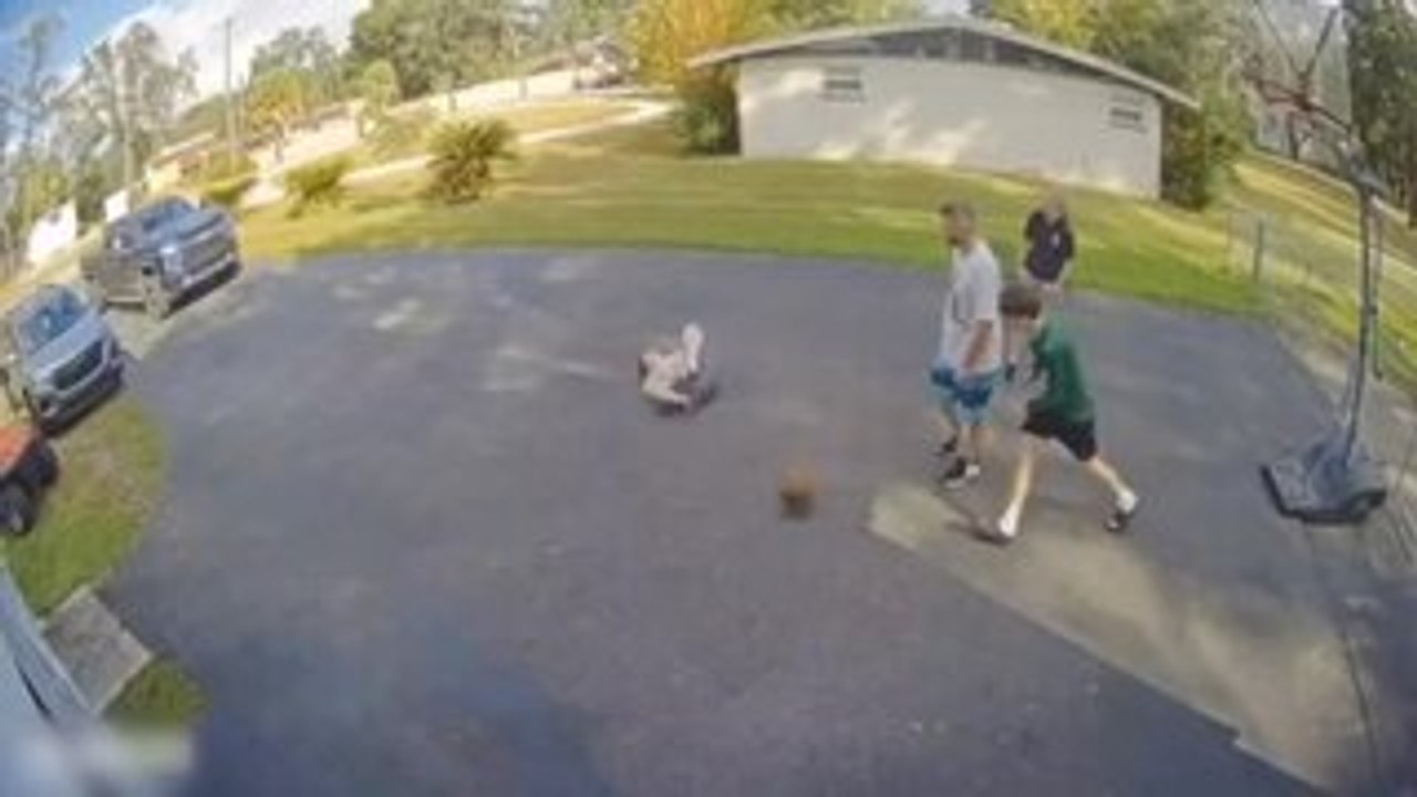 Boy Slips While Playing Basketball
