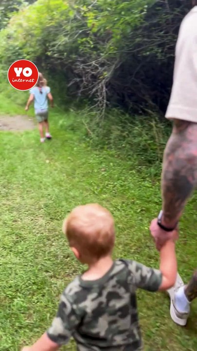 Youngster approaches puddle but loses balance and tumbles in