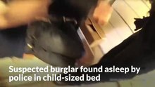 Suspected burglar found asleep by police in child-sized bed