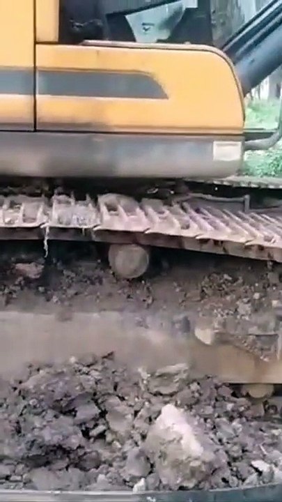 Man vs. Mud: Manual Cleaning of an Excavator in a Borneo Mine