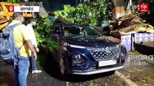 धनबाद में आंधी-बारिश का असर, सड़क पर गिरा पेड़, कार क्षतिग्रस्त