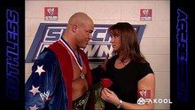 Stephanie McMahon kisses Kurt Angle after he gives her a rose