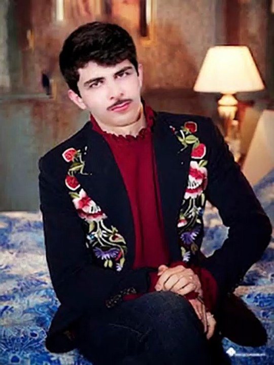 A_young_couple_is_taking_a_mirror_selfie_