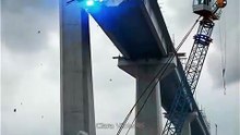A realistic cinematic disaster scene at a large bridge construction site.This video is AI-generated