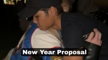 A lovely midnight proposal unfolds beneath exciting New Year’s fireworks