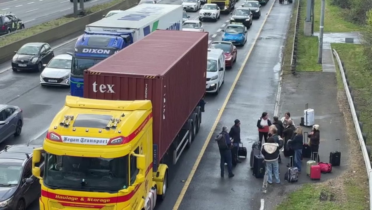 Irish fuel protests: People walk along motorway towards Dublin Airport as blockade continues