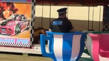 Policeman Takes A Spin On The Teacups With Ice Cream In Hand