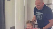 Over-the-moon toddler mounts the pole like a 'little monkey'