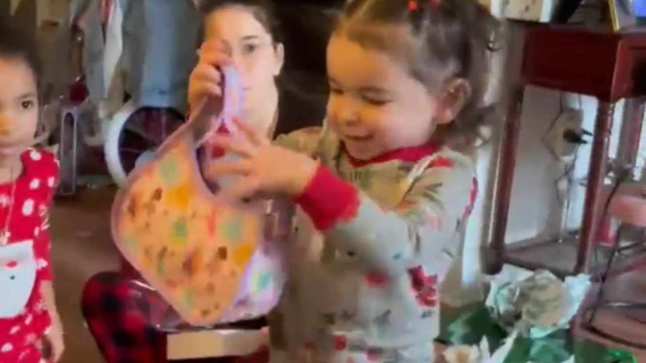 Young Girl Struts with Runway Flair While Unveiling Her New Handbag