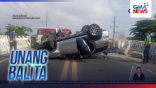 SUV, bumaligtad matapos araruhin ang ilang concrete barrier at isang utility van | Unang Balita