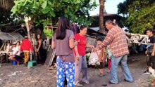 Mom Virgie With Her Guests Buying Fresh Fish At The Beach