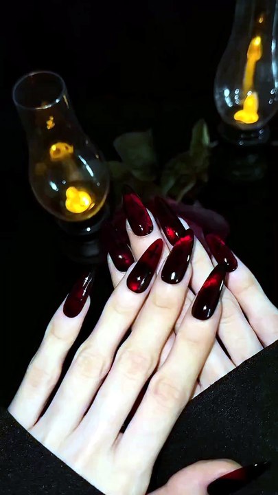 Dare to go dark? Slip into something wicked with our red cat eye. ❤️💀 — #pressonnails #nailsart #gothgirls #cateyenails #cateyegel