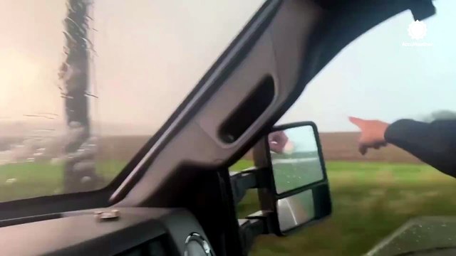 Storm chasers intercept tornado in Illinois as it downs power poles