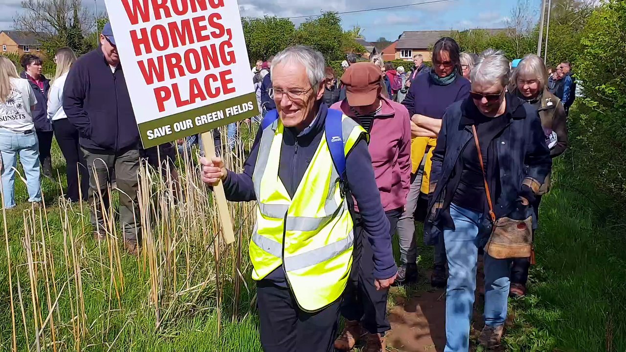 Protect Wellington demonstrators set out on a protest walk using public footpaths across farmland where developers want to build 250 houses.