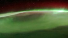 Earth's Nightly Spectacle: Auroras and City Lights from Space