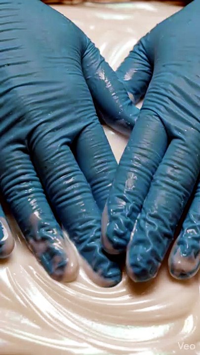 Silk Motion: Gloved Hands Creating Fluid Waves