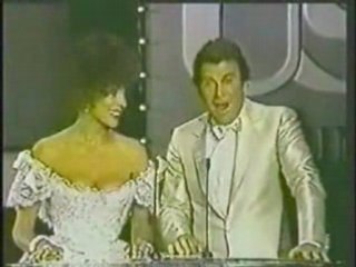 JOAN COLLINS PRESENTING AWARD