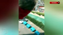 Başakşehir'de pencereden sarkıttığı köpeği cama vurup kaydetti
