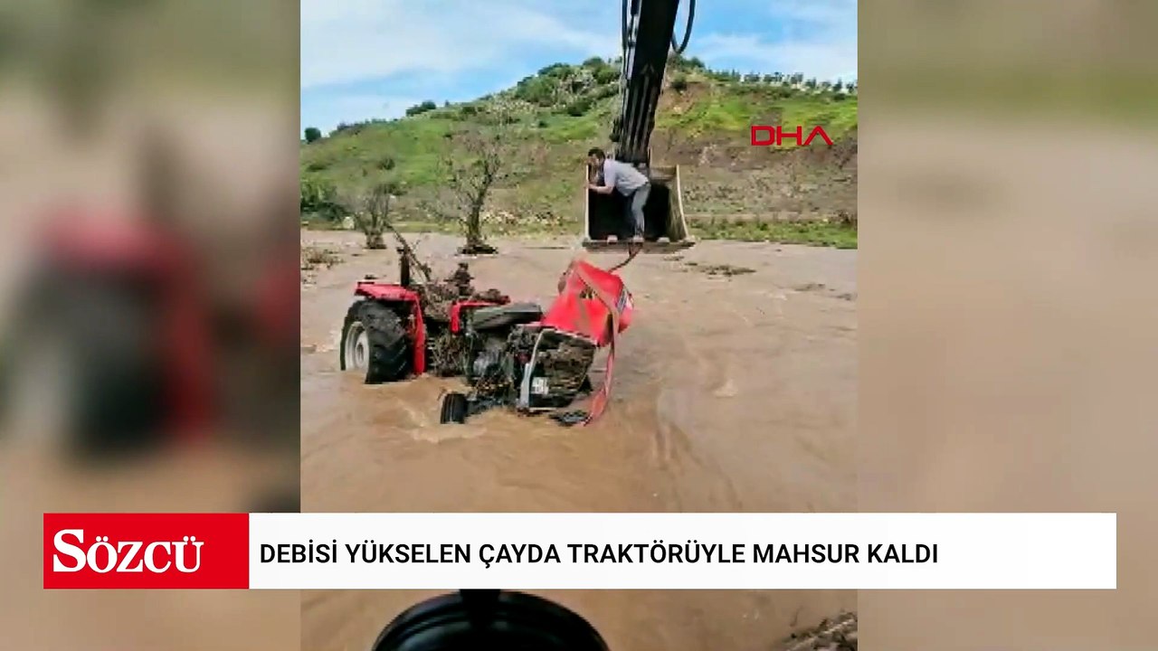 Debisi yükselen çayda traktörüyle mahsur kaldı