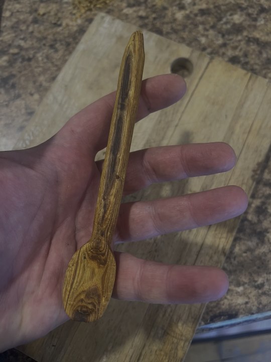 Blind dude carving a spoon.