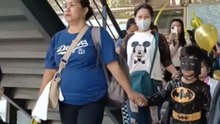 Kids Line Up And March With Their Parents And Staff In A Hospital