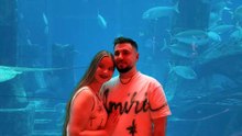 Boy Kneels Down As Diver Displays Proposal Message Underwater