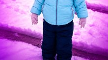 Little girl discovers that frolicking in the snow is no easy feat