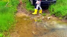 Car passes the road covered in mud