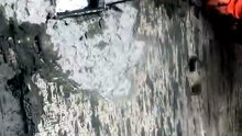 Fixing an electrical board in a brick wall.