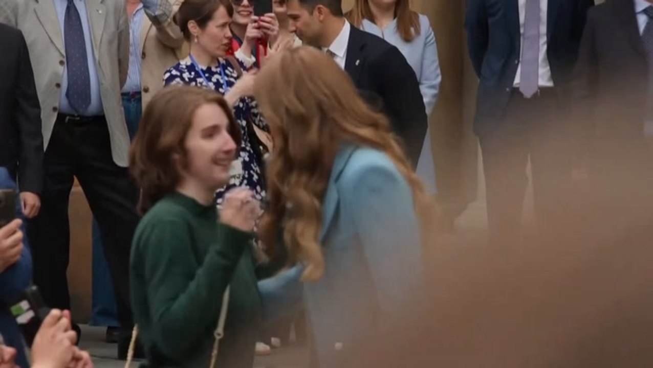 Kate hugs young royal fan as she makes first overseas trip since cancer treatment