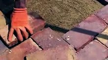 Brick floor tile fixing.