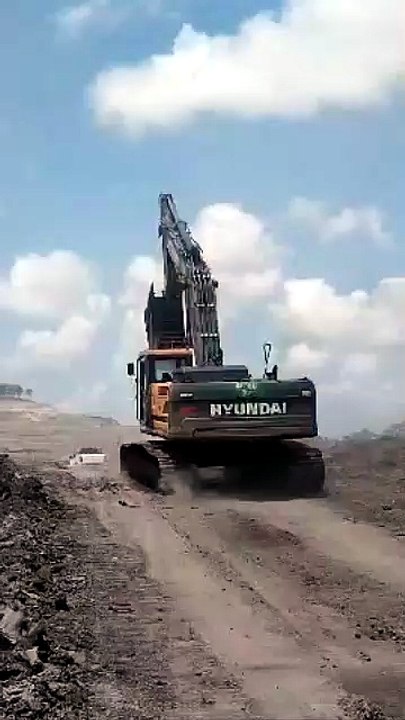Heavy Equipment In Action : Large Hyundai Excavator at a Kalimantan Coal Mine, Indonesia