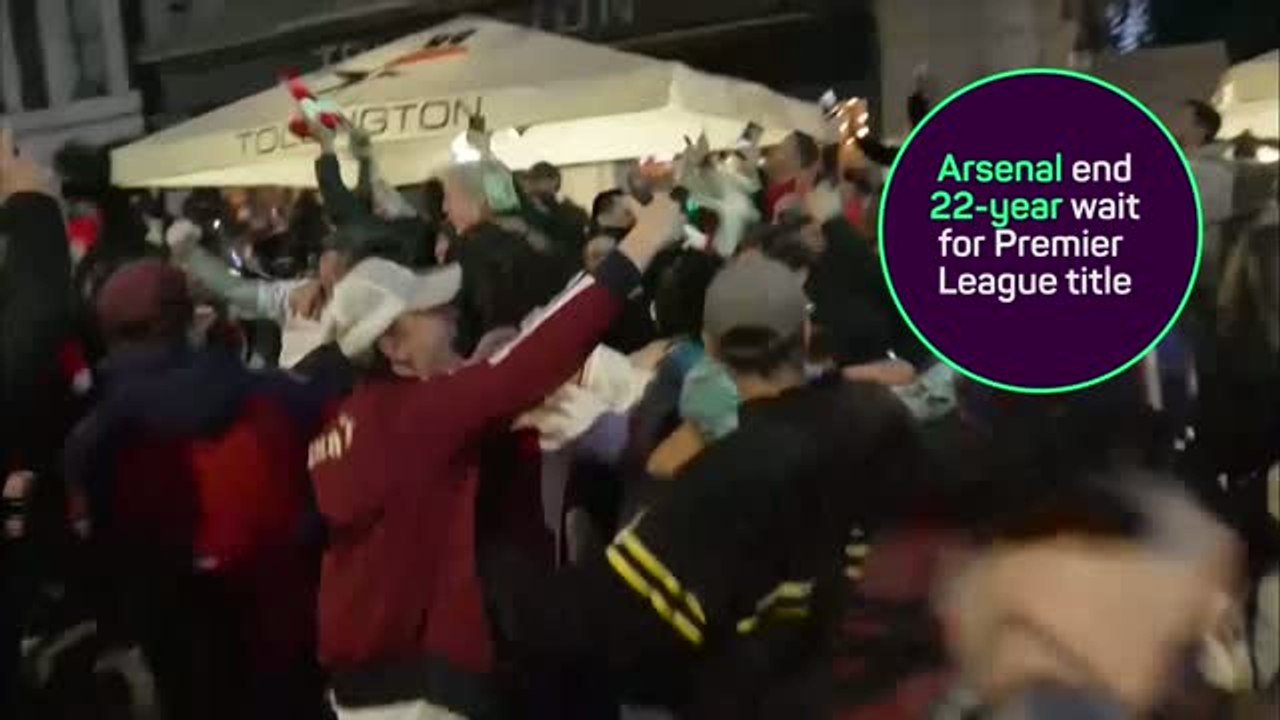 Arsenal fans party in the streets of north London after winning Premier League title