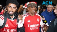 Arsenal players celebrate with fans after ending 22-year Premier League drought