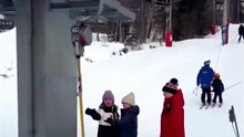 Two Girls Use a T-Bar Ski Lift Completely Wrong