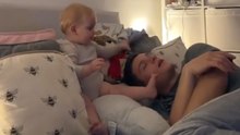 She really got me this time! - Playful baby wakes dad with a remote while he's napping