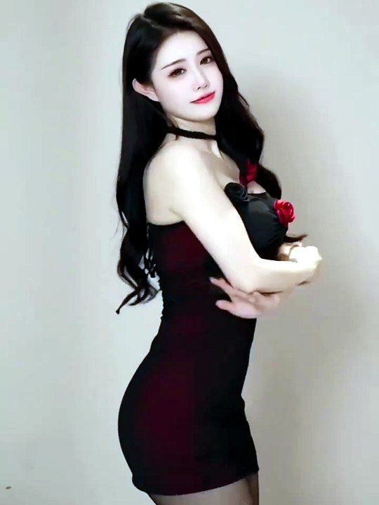 Luxury black party dress with romantic rose details and elegant feminine look