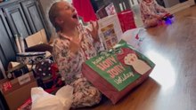 Lively gamer girl bubbles with happiness after being surprised with an Oculus