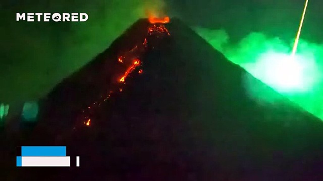 A meteor streaks across the sky during the eruption of Mayon Volcano, Philippines