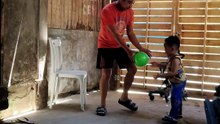 Isaiah playing balloon