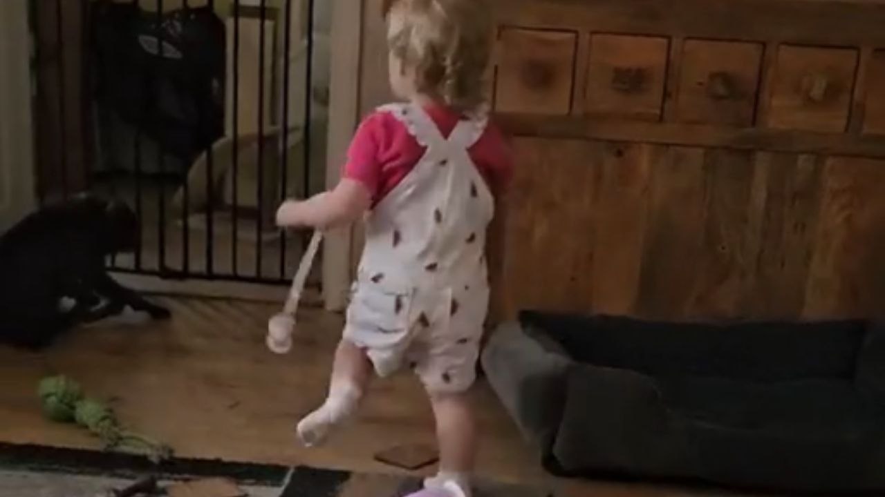 Unconditional Love: Young Girl's Sweet Kiss for Her Furry Friend